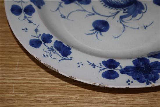 An 18th century Glasgow Delftware charger and a matching plate, largest 35.5cm